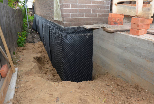 Happy homeowners after waterproofing job in Waverly